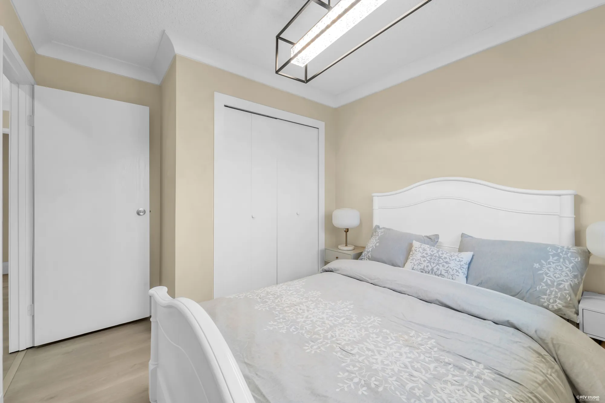 The same bedroom looking toward its closet doors