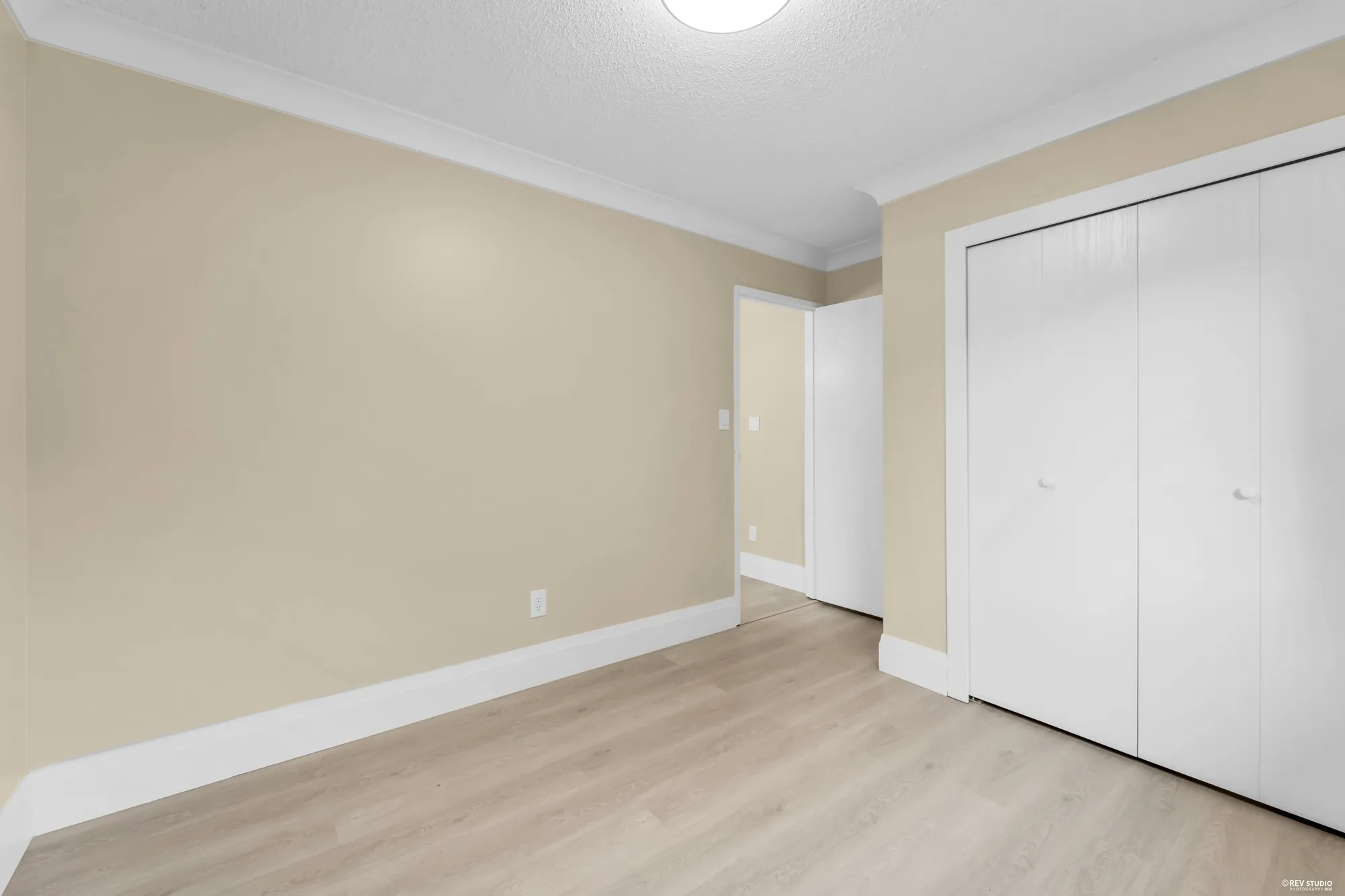 The same bedroom looking toward its closet