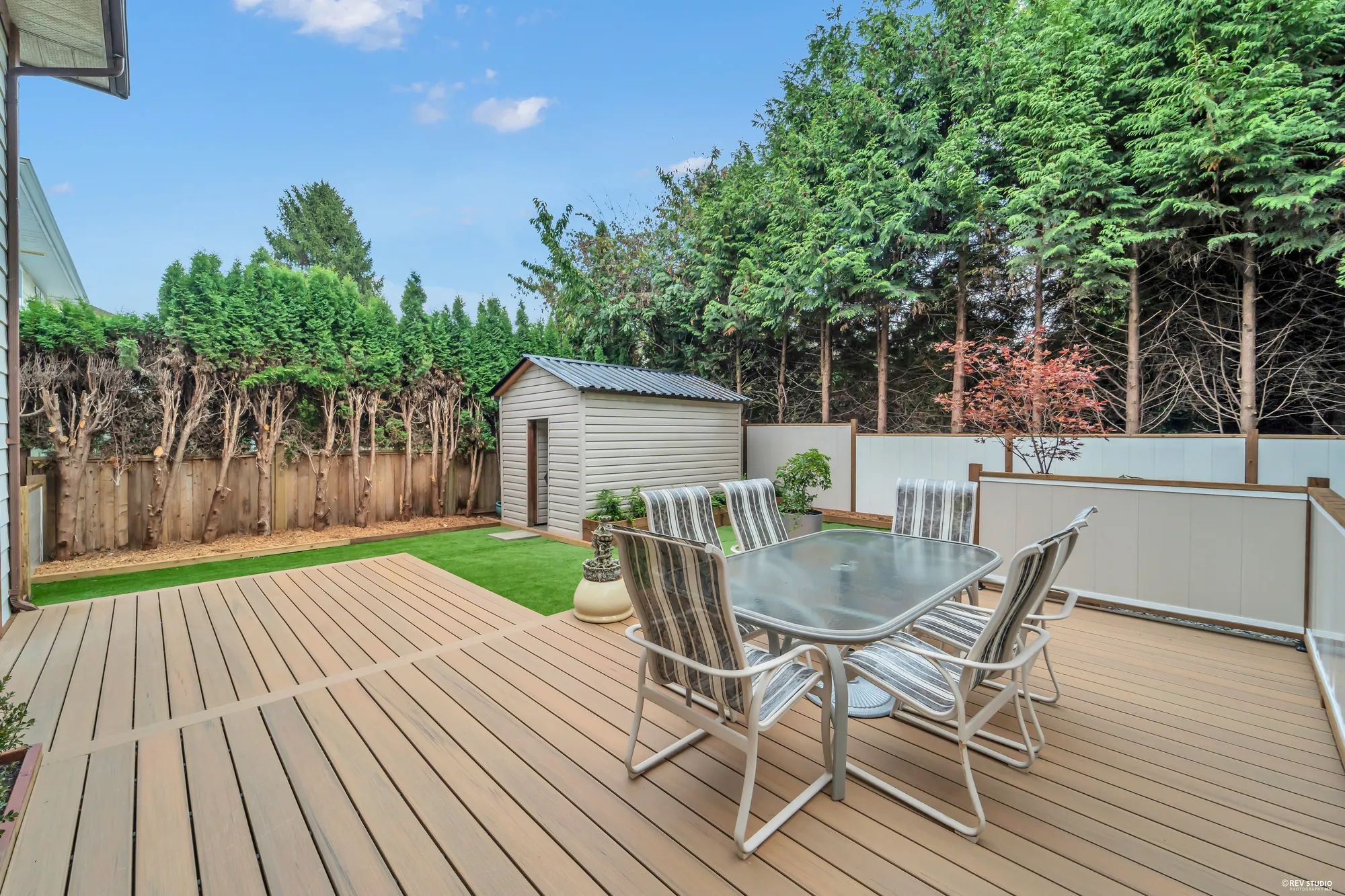 The deck looking toward the shed at the far end of the garden