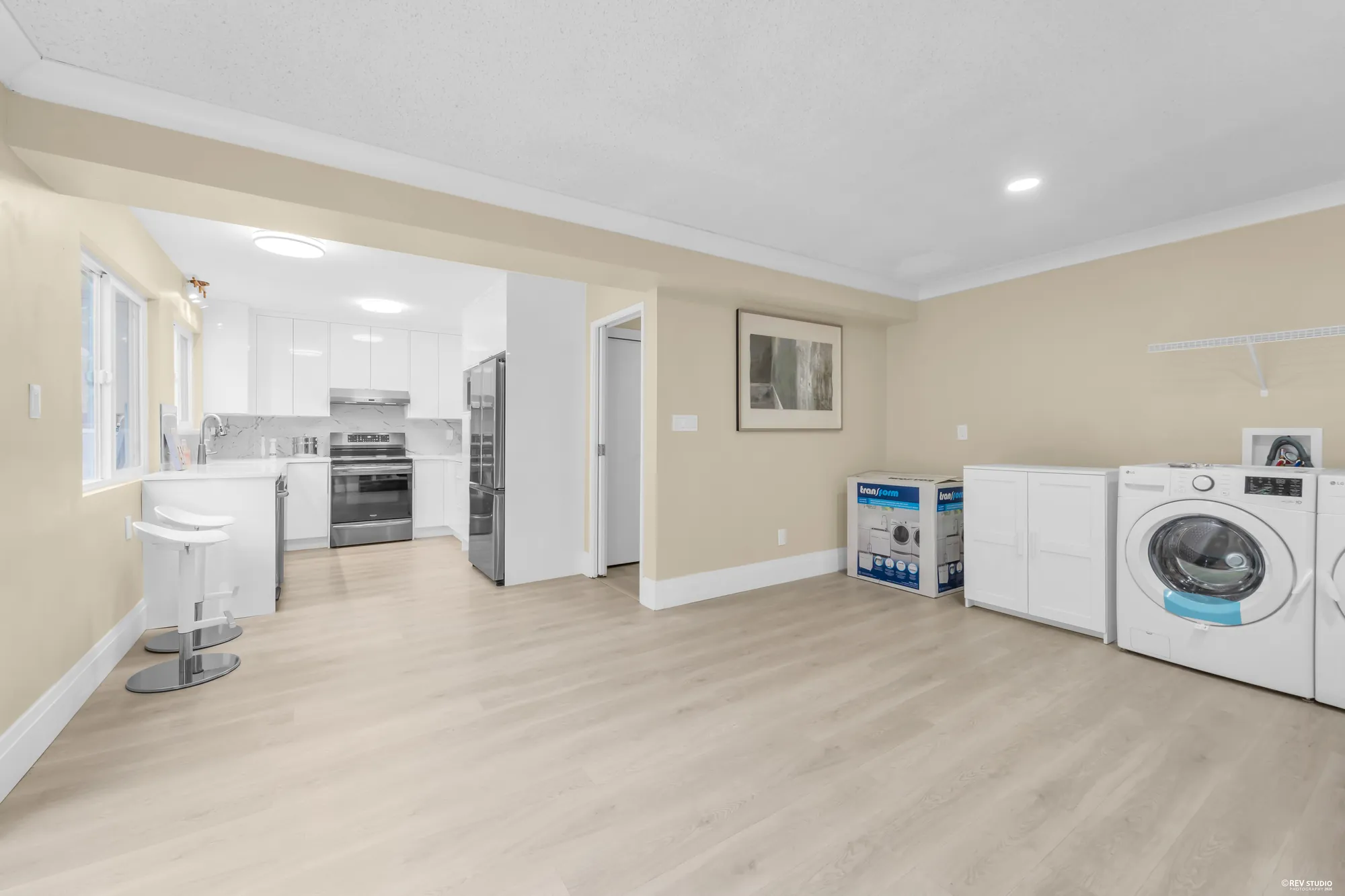 From the family room into the kitchen, the laundry pair on the right